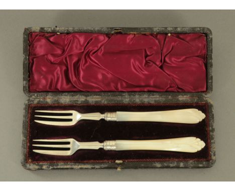 A pair of Victorian silver and carved mother of pearl handled cake forks, the blades by Hilliard &amp; Thomason Birmingham 18