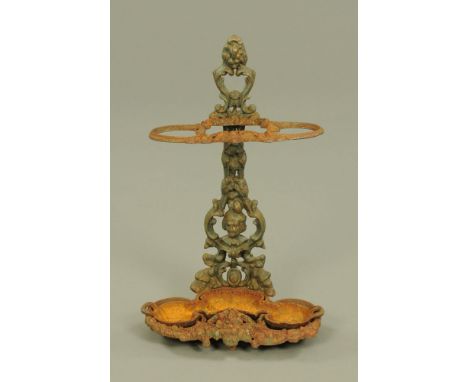 A Victorian cast iron hall stick stand, with detachable drip tray.  Height 65 cm, width 41 cm.