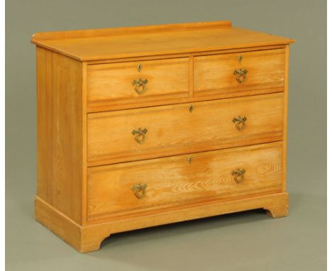 A late Victorian light oak chest of drawers of Arts and Crafts design.  86 cm high, 107 cm wide, 53 cm deep.