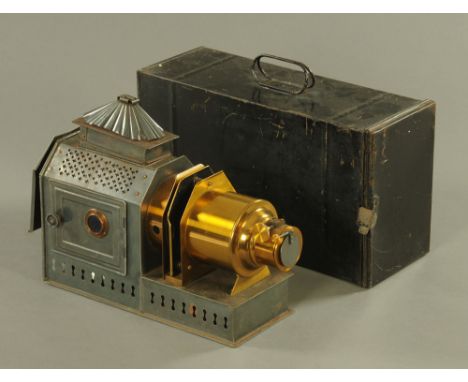 An 20th century Archer and Sons of Liverpool brass and tin plate magic lantern, 39 cm long, contained in ebonised metal case.