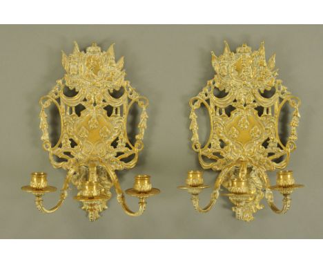 A pair of 19th century brass three branch candle sconces, probably French, each with profile portrait bust.  Height 34 cm, wi