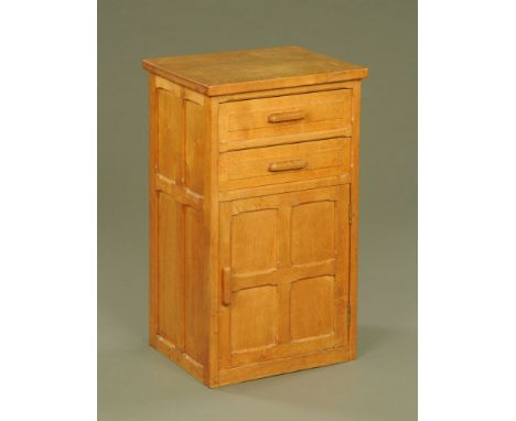 A panelled light oak bedside chest, fitted two drawers and cupboard, 74 cm high x 43 cm wide x 36 cm deep.