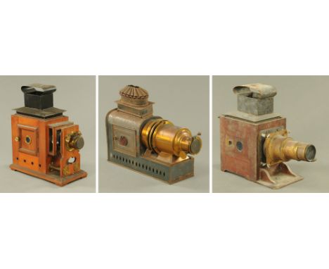 Three 19th century magic lanterns, 46, 40 and 40 cm high respectively, two converted to electricity. CONDITION REPORT: All th