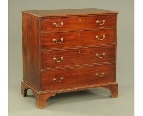 An early 19th century mahogany chest of drawers, with applied moulded edge above four long graduated drawers with brass drop 