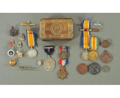 A 1914 Christmas tin containing a collection of medals including World War One group to F. Wood, Peace Medal, World War One m