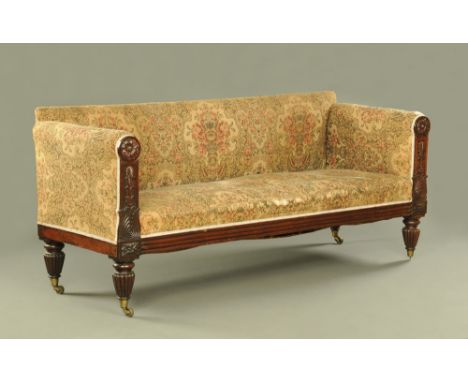 A 19th century continental rosewood three seater settee, the uprights with leaf and floral carving, upholstered in machined t