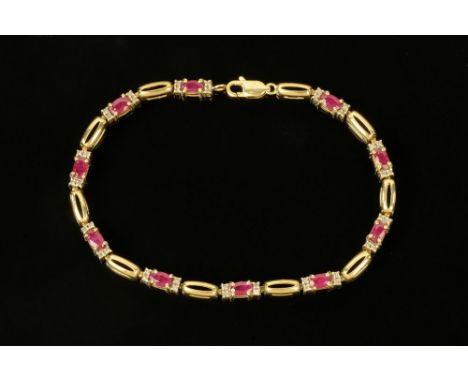 A gold coloured metal diamond and ruby set tennis bracelet, stamped 9 k, 6.3 grams, length 19.5 cm (see illustration).