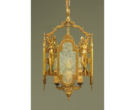 A glass and brass lantern type hall light fitting, decorated with three graces type figures and stamped Made in Italy.  Heigh