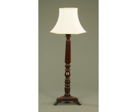 A mahogany bed post lamp standard, with triform base and complete with chinoiserie beige hexagonal shade.