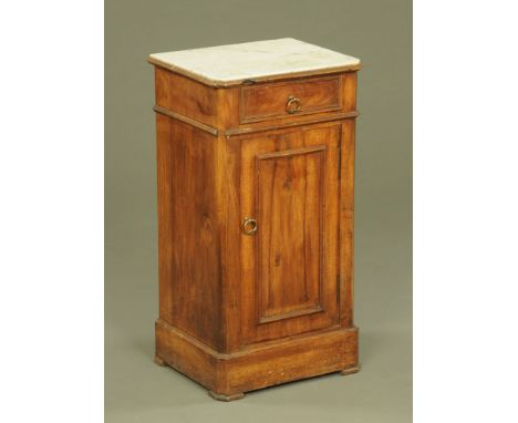 A continental marble topped bedside cabinet, with drawer above a panelled cupboard door flanked by canted angles and raised o