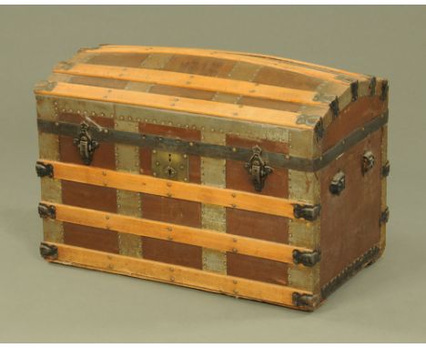 A late Victorian brown cloth and wood bound domed top travelling trunk.  47 cm high, 73 cm wide, 40 cm deep. CONDITION REPORT