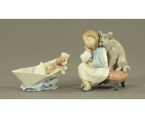 Two Lladro figures, dog in boat and girl with dog.  Tallest 16 cm.