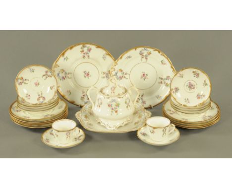 A Victorian pottery tea service, gilded and enamelled in colours with blue bows and floral sprays (27 pieces).