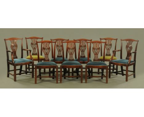 A set of nine George III mahogany dining chairs, of Chippendale design, with pierced vase shaped splats carved with Fleurs de