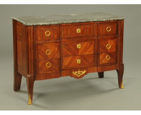 A 19th century continental marble topped commode chest of three drawers, with brass drop handles and lock escutcheons and rai