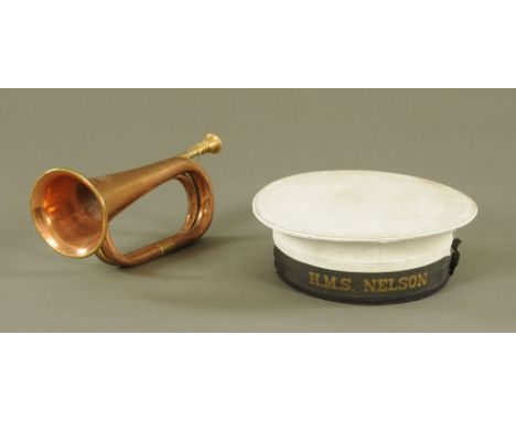 An HMS Nelson ratings hat, together with a Boosey and Hawkes bugle.