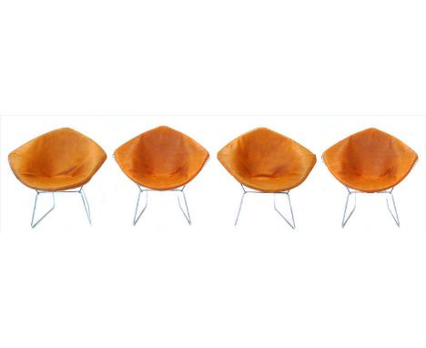 Four 1970's diamond shaped chromium plated wire-work chairs with cushioned seats, designed by Harry Bertoia.Harry Bertoia was