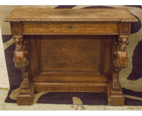 CONSOLE TABLE, circa 1870, Continental oak, with frieze drawer supported by carved Griffins, 100cm W x 32cm D x 84cm H.