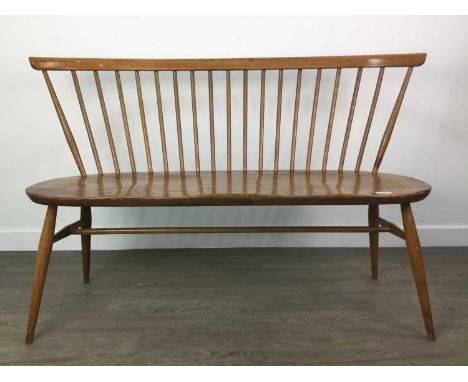 LUCIAN ERCOLANI FOR ERCOL,a 1960s Model 450 Love Seat, in beech and elm, 121cm wideCondition report: Condition good to fair. 