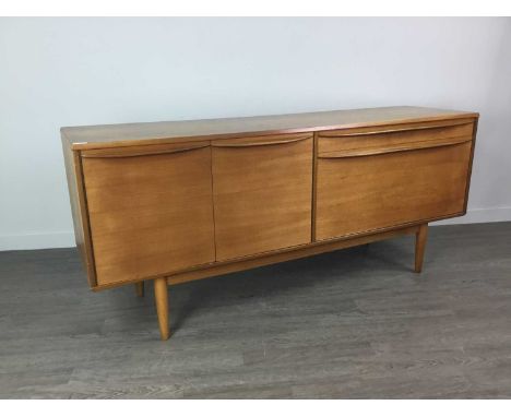 MID-20TH CENTURY TEAK SIDEBOARD,the twin doors enclosing single shelf, with cutlery drawer to upper right above drop-down doo