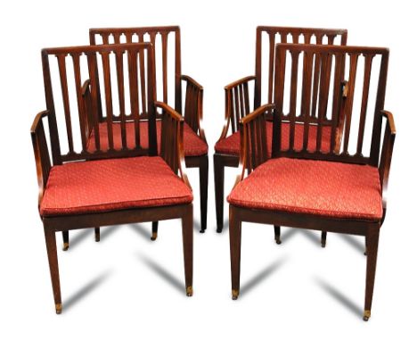 A set of seven 19th Century mahogany rail back elbow chairs, circa 1800, now with squab seats, on square tapered legs with br