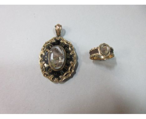 A mid-19th century hairwork ring and an enamel and hairwork memorial pendant, the ring with an oval glazed panel containing s