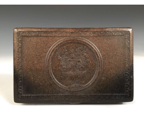 An early 19th century horn cased Swiss key wound musical box, the rectangular lid moulded with bowl of flowers roundel, the m