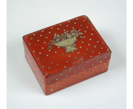 An 18th century gold pique, red stained bone or vegetable ivory compartmental seal box, the rectangular lid worked with a bas