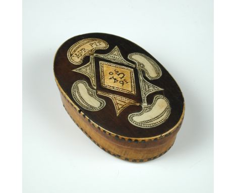 A horn inlaid wood oval snuff box dated 1650, the central diamond to the oval lid inscribed '1650 CK your Pup' within four ki