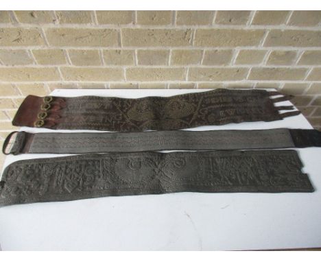 Three various studded leather hunting belts, one dated 1736 and another 1762, the dated belts each with four clasps, the earl