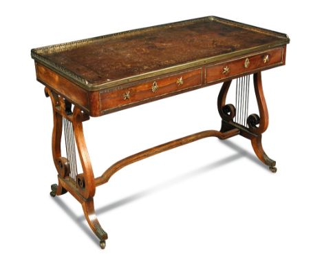 A Regency ormolu and brass mounted rosewood writing table, circa 1810, in the manner of John McLean, with greek key pierced t