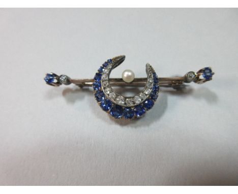 A sapphire, diamond and pearl crescent on bar brooch, the closed crescent formed of an outer graduated line of oval to round 