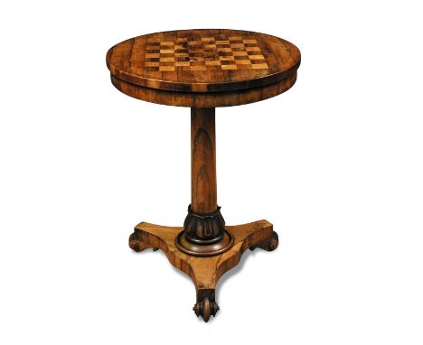 A William IV rosewood drum top chess table, on a lappet carved and triform base with scrolling feet 74 x 55cm (29 x 21in)  