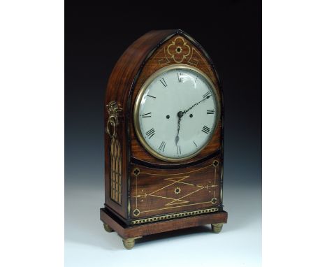 A Regency mahogany and brass inlaid lancet top bracket clock, the repainted or replacement 8inch dial with shaped hands and R
