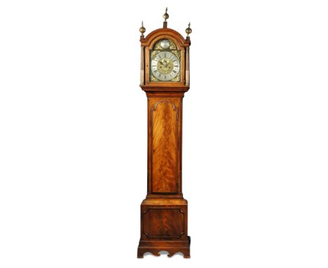 An 18th century mahogany longcase clock, the break arch hood with three ball finials, side fret panels, 12inch brass dial wit