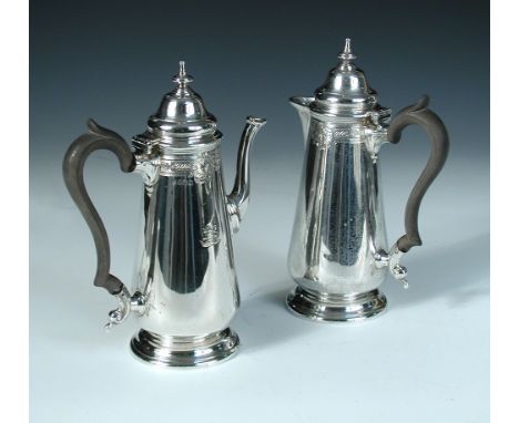 A silver cafe-au-lait set, by Thomas Bradbury & Sons, Sheffield 1918, comprising a slim baluster shaped coffee pot the upper 