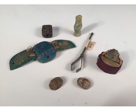 Ancient Egyptian wares to include a ring, amulet and scarabs, the flower head ring possibly 9-10th century BC, a late period 