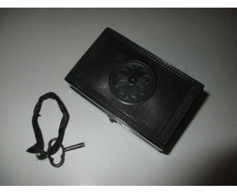 A 19th century horn cased musical box with key, probably Swiss, the key wound movement playing airs on a single comb, 7cm (2.