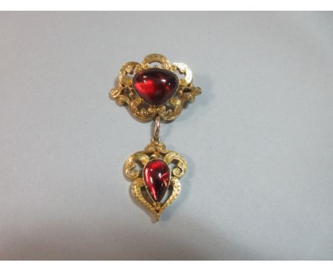 A 19th century Continental foiled hardstone brooch and pendant, the principal stone a cushion triangular cabochon claw set in