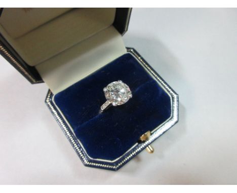 An impressive and certificated single stone diamond ring, the round brilliant cut diamond weighing 2.97cts, colour J and clar