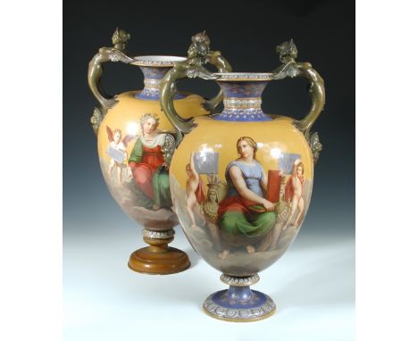 Attributed to Minton, a pair of mid Victorian majolica vases, each with sea green caryatid handles above mask terminals on oc