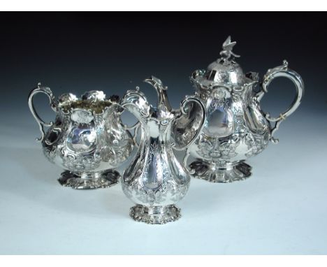 A Victorian silver three piece tea set, by Martin, Hall & Co, Sheffield 1858, comprising:- a teapot raised from a circular fo