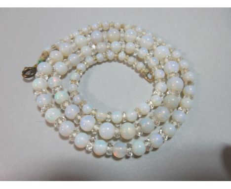 An opal and rock crystal bead necklace, the 3.5 - 7mm graduated opal beads separated by faceted rock crystal rondels, length 