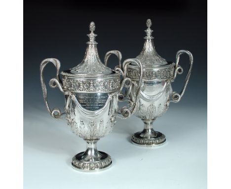 A pair of Edwardian silver cups and covers, by The Goldsmiths' and Silversmiths' Company, London 1908/1910, each of vase shap