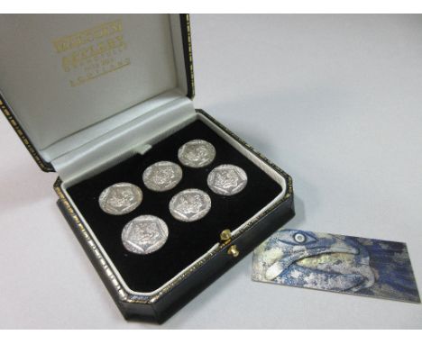 A set of six silver leopard's head commemorative buttons by Malcolm Appleby in original case, each circular button stamped wi