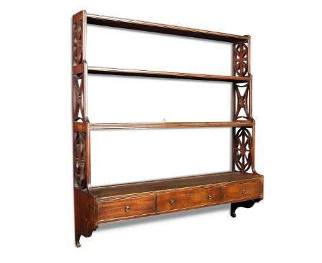 A 19th century oak wall shelf, of four graduated tiers with three small drawers 99 x 92 x 23cm (39 x 36 x 9in)  