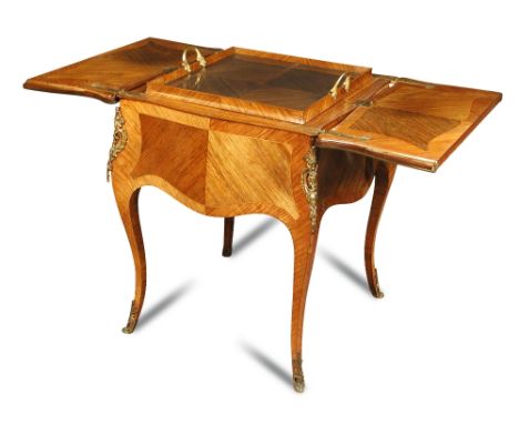 A 19th century French Transitional style kingwood decanter cabinet, with a fitted rising tray interior, enclosed by the openi