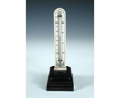 A Victorian ivory desk thermometer by West of Fleet Street, London, mounted to an ebonised plinth base 27cm (11in)  