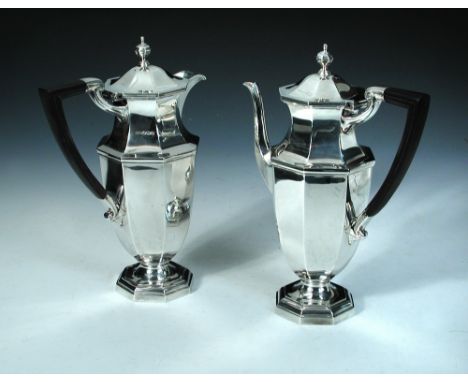 A silver cafe-au-lait set, by Mappin and Webb, Sheffield 1932, comprising: a coffee pot of octagonal baluster form on a pedes