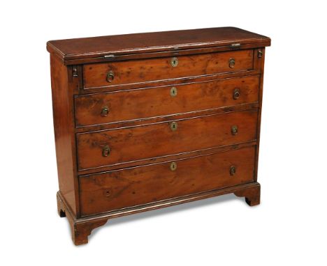 A yew wood bachelor's chest of four drawers, with fold over top, above four long drawers, brass penny and ring handles, on br